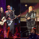 (L-R): Brian Bell, Rivers Cuomo and Scott Shriner of Weezer perform onstage during Dick Clark’s New Year’s Rockin’ Eve With Ryan Seacrest 2019 on December 31, 2018 in Los Angeles, California.; Tionne ‘T-Boz’ Watkins (L) and Rozonda ‘Chilli’ Thomas of the music group ‘TLC’ perform onstage during the I Love The 90s The Party Continues on July 14, 2017 in Los Angeles, California.